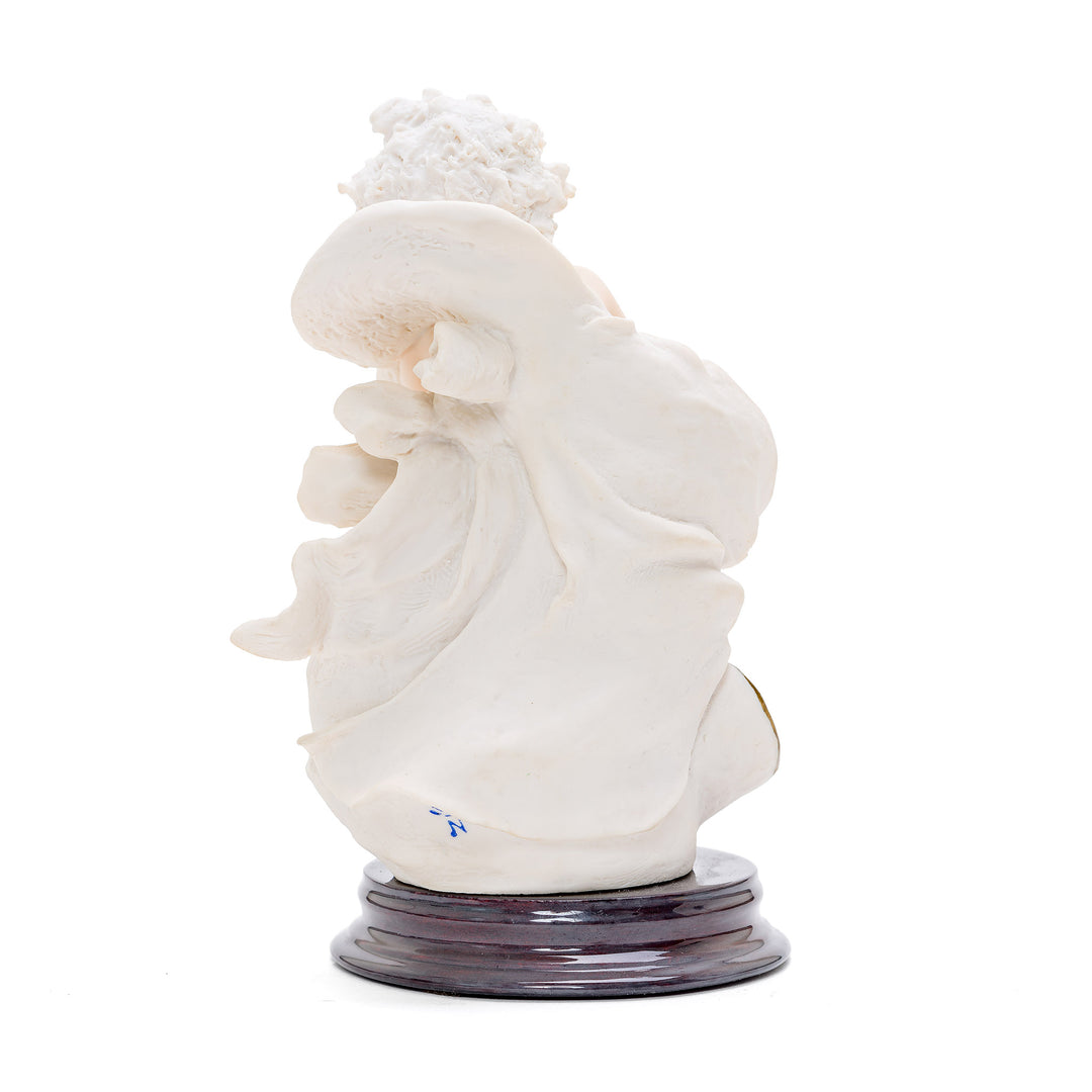 Cherub with sea-goat porcelain sculpture representing Capricorn sign.