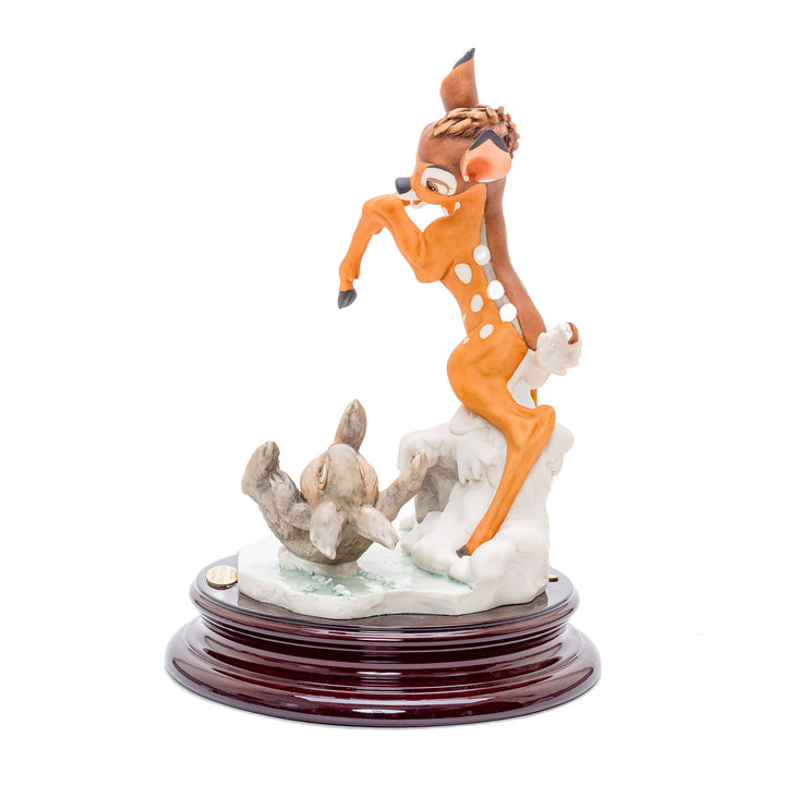 Italian crafted porcelain figurine of woodland creatures in playful pose.