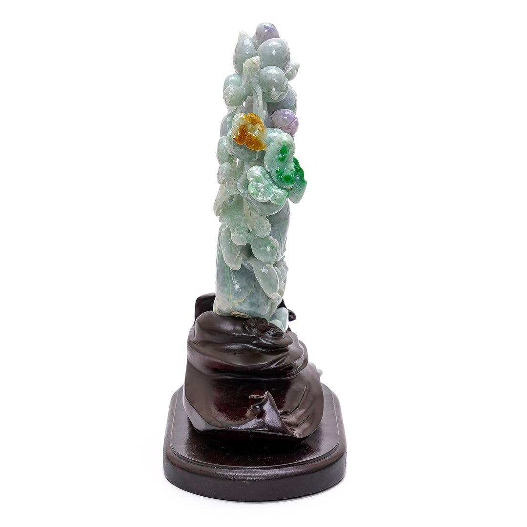 Serene jade peach tree on decorative wooden base.