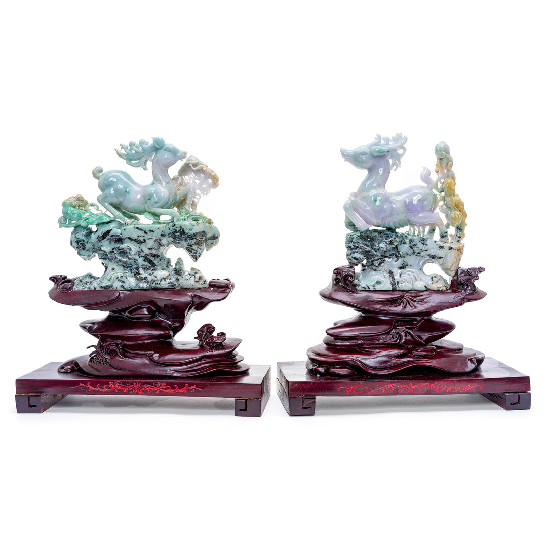 Museum-quality jade reindeer pair with mirror image design on carved wood base