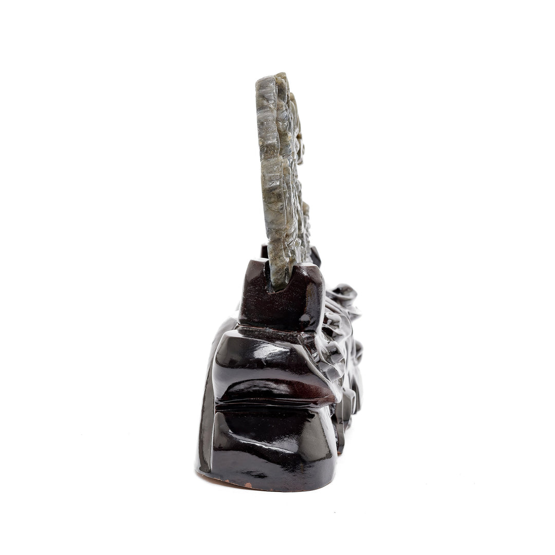 Side angle of gemstone battle sculpture in labradorite