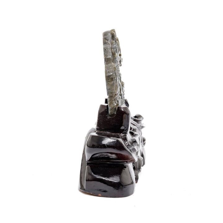 Side angle of gemstone battle sculpture in labradorite