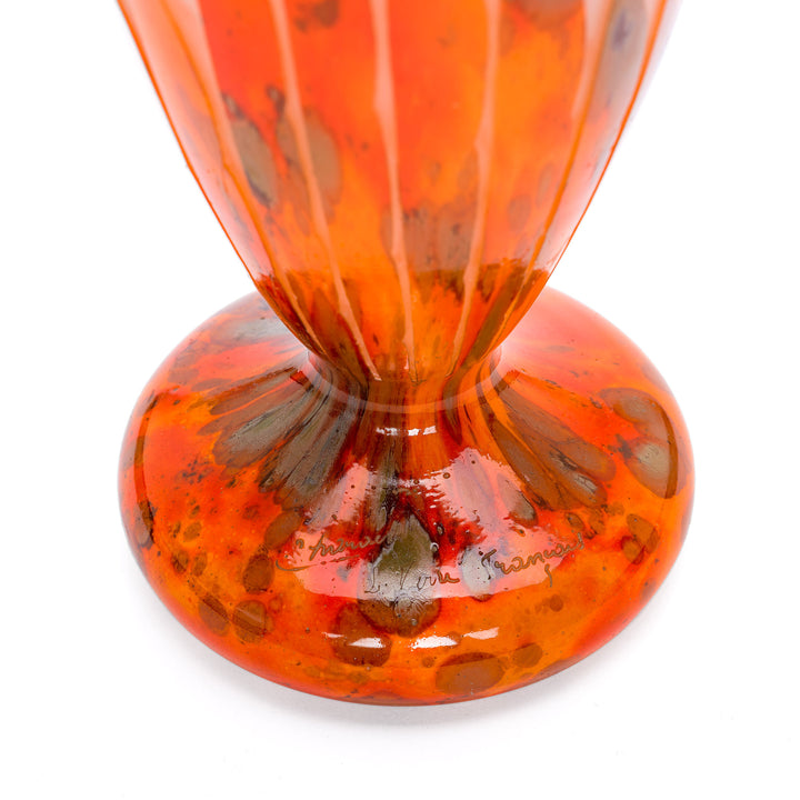 Bright orange Le Verre vase, emblematic of 1920s art glass innovation.