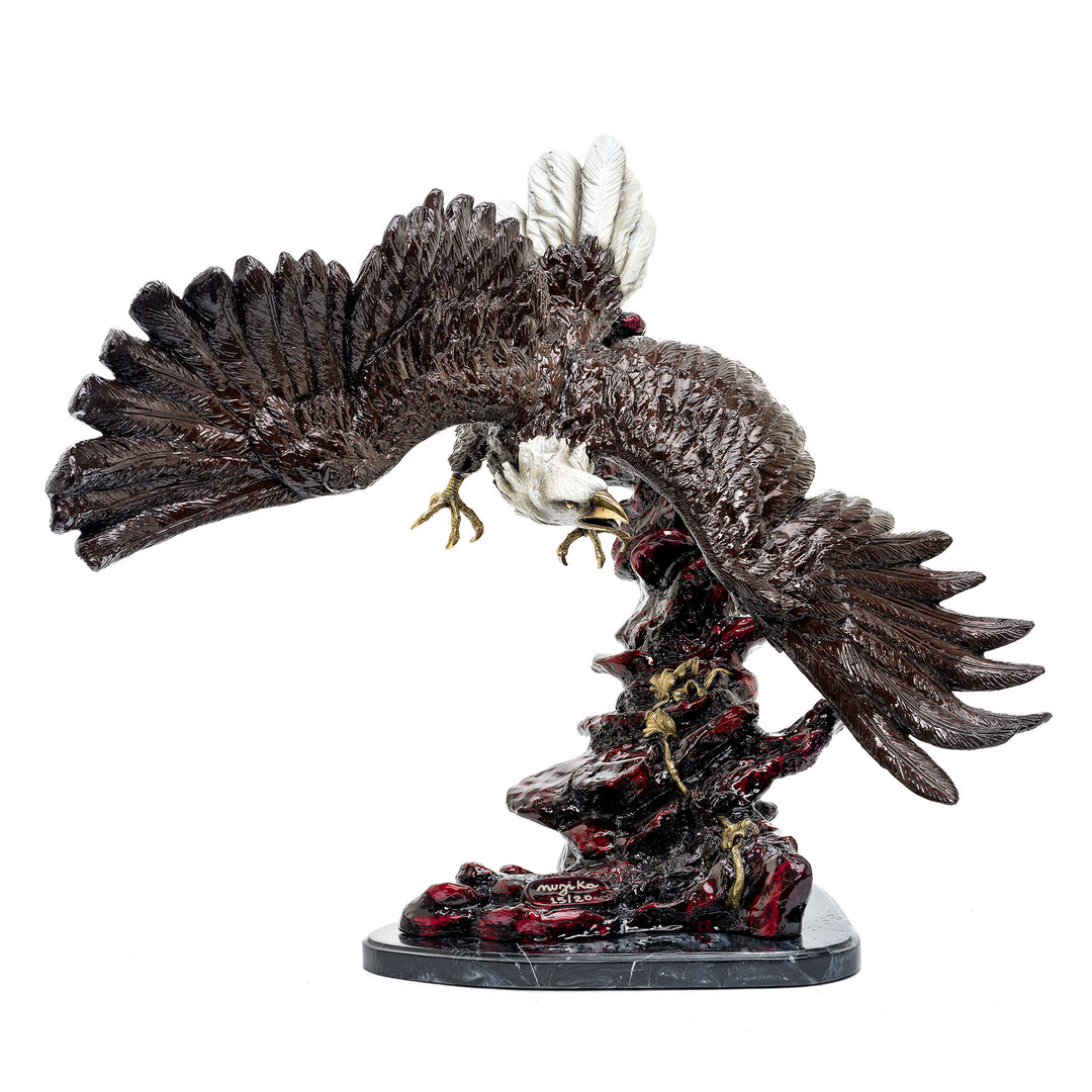 Bronze sculpture of a flying eagle with outstretched wings