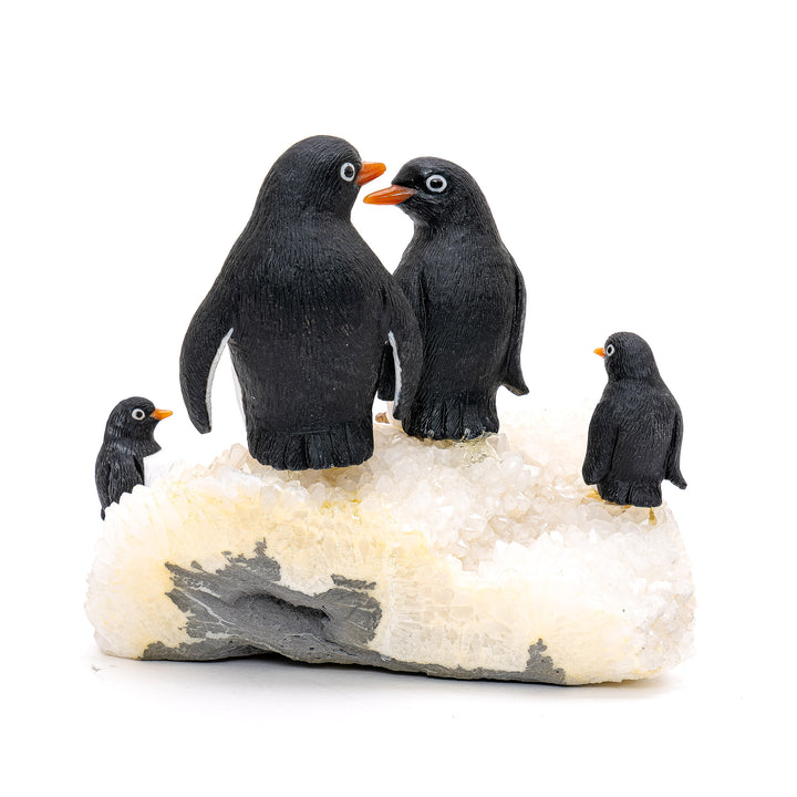 Obsidian and white quartz sculpture capturing Antarctic wildlife