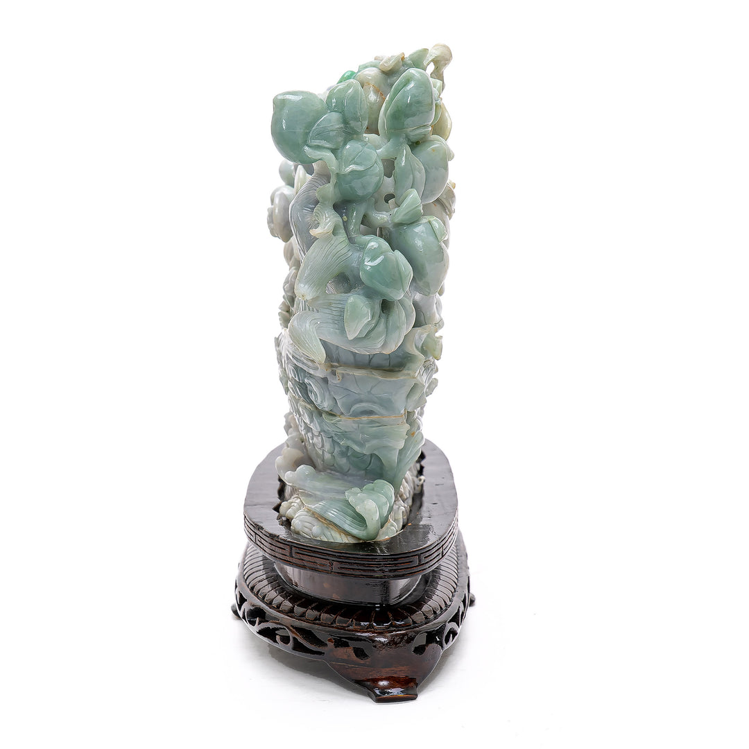Jade sculpture featuring dragon and children figures.
