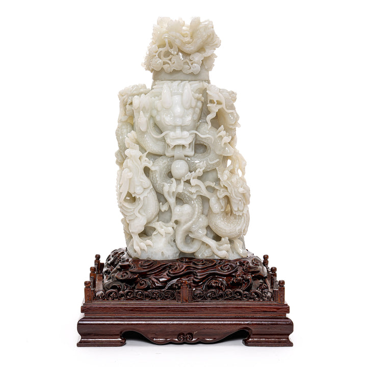 Museum-quality jade sculpture with writhing dragons.