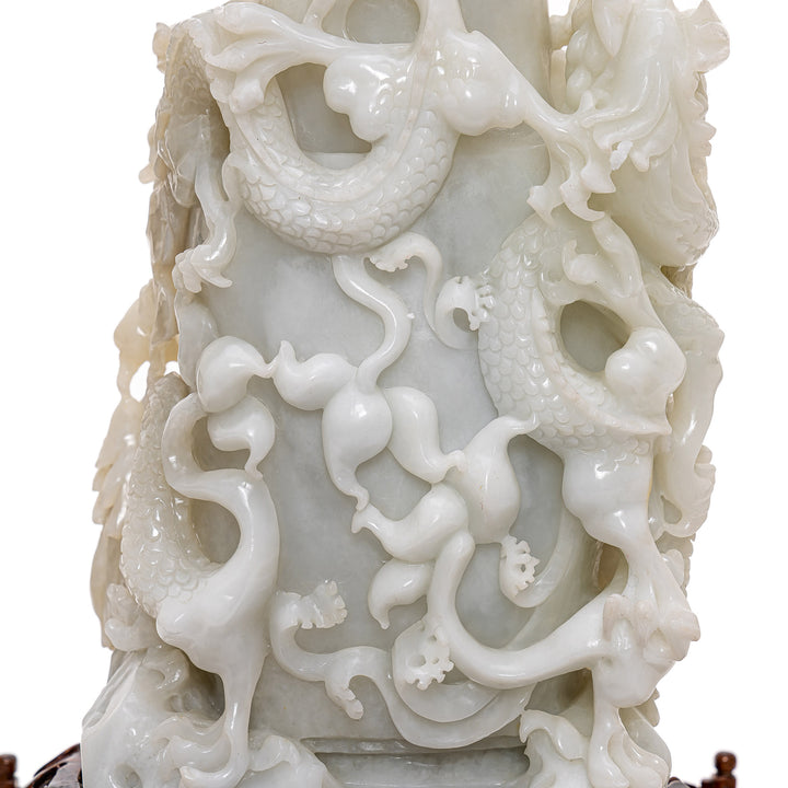 Intricate carving of dragons seeking the pearl of wisdom.
