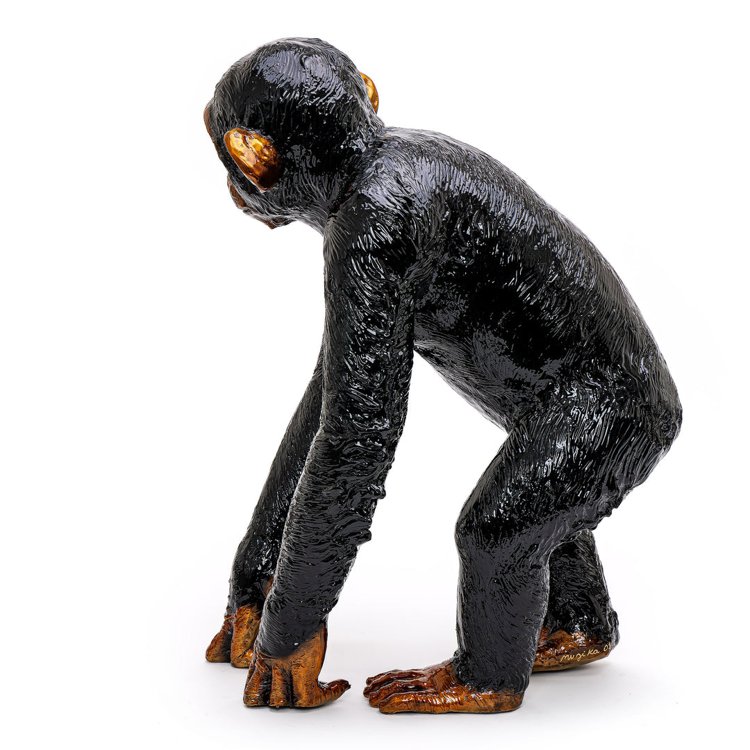 Signed bronze masterpiece by Muzika showcasing a chimpanzee.