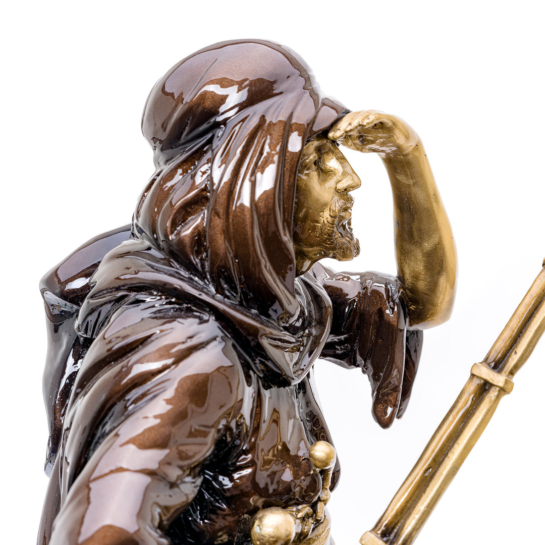 Artistic bronze representation of a traveler's journey across the desert
