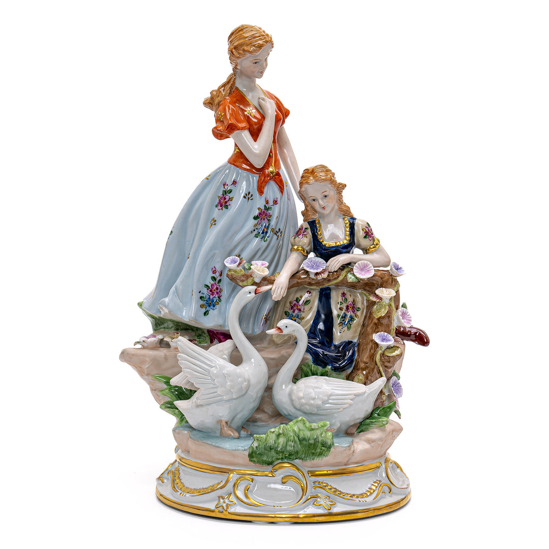 Handmade porcelain sculpture depicting two ladies with graceful swans.