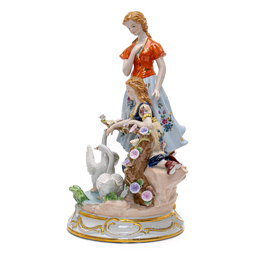 Artisan-crafted figurine of elegantly dressed ladies with serene swans.
