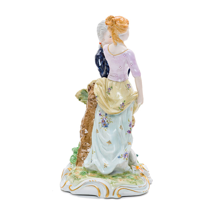 Elegant handmade porcelain art featuring a courting couple and farm animal.
