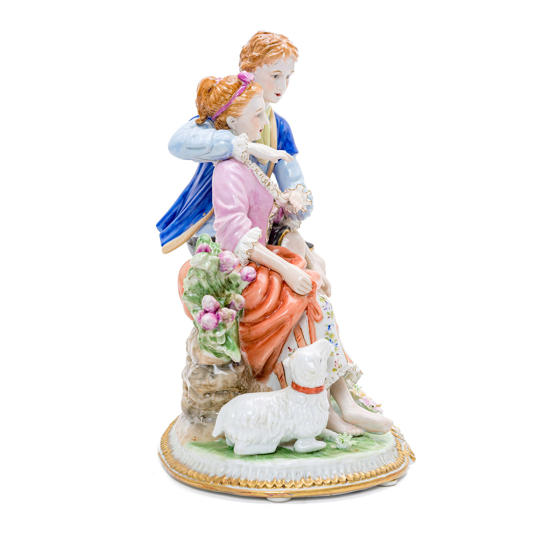 Exquisitely detailed seated couple with dog and goat porcelain art.