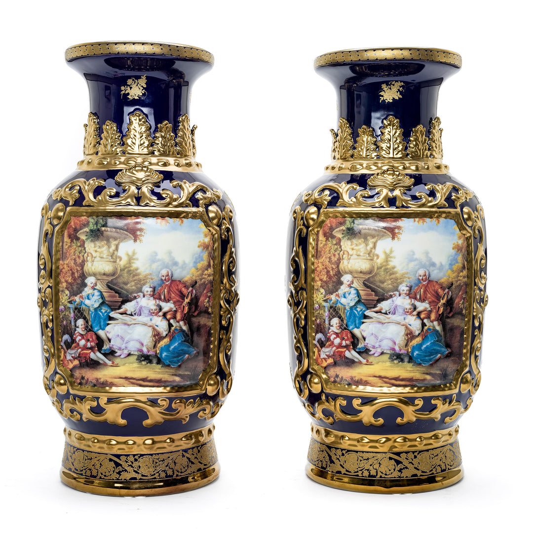 Pair of Cobalt Porcelain Vases with Handpainted Courtyard Scenes and Gold Details.