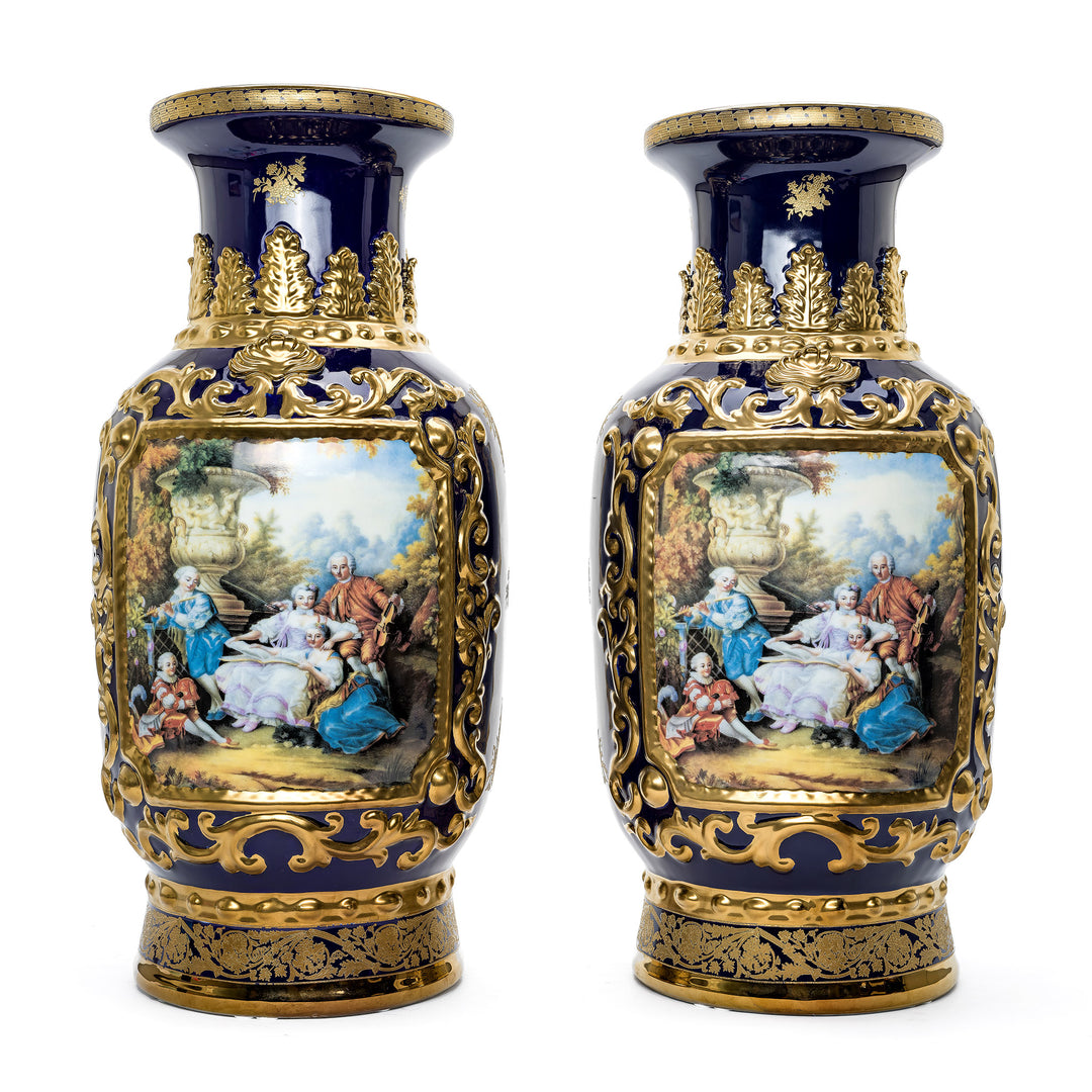 Artisan-Crafted Porcelain Vase Duo with Gilded Accents and Figural Art.