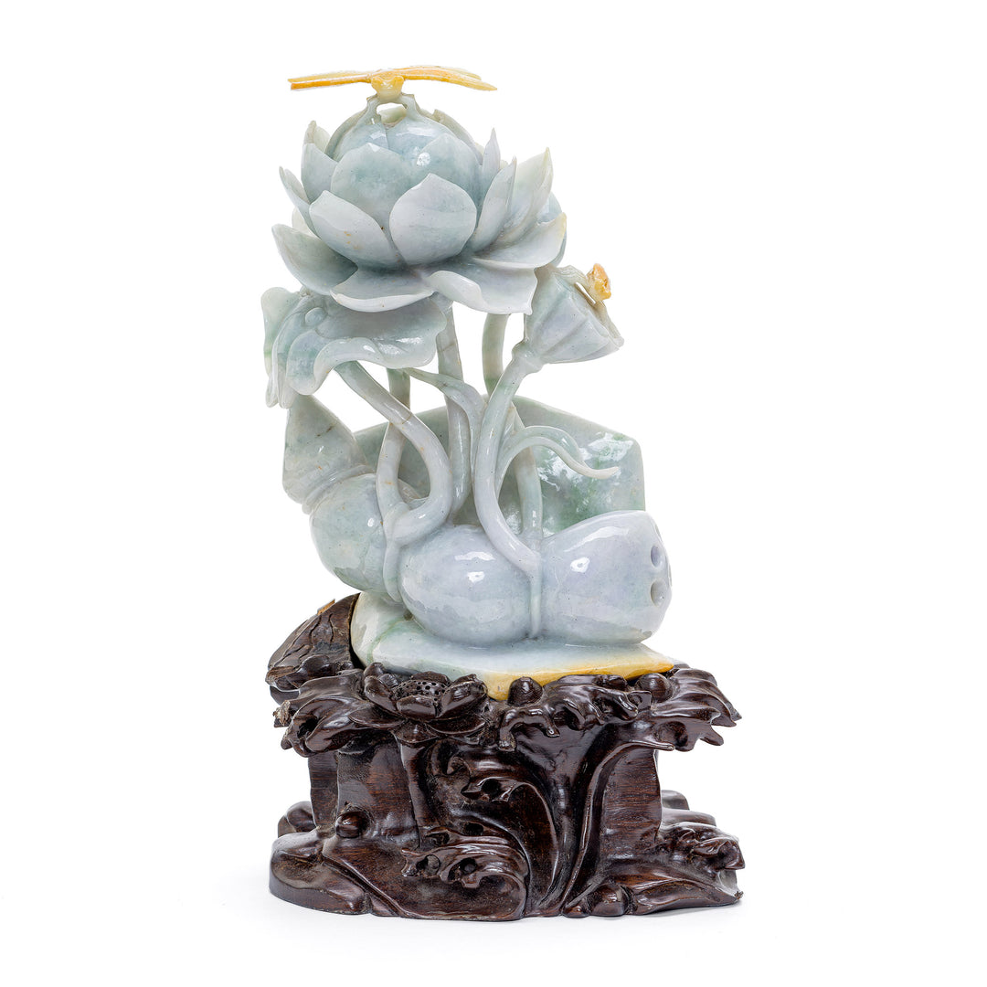 Jade peony sculpture with a dragonfly, symbolizing prosperity and change
