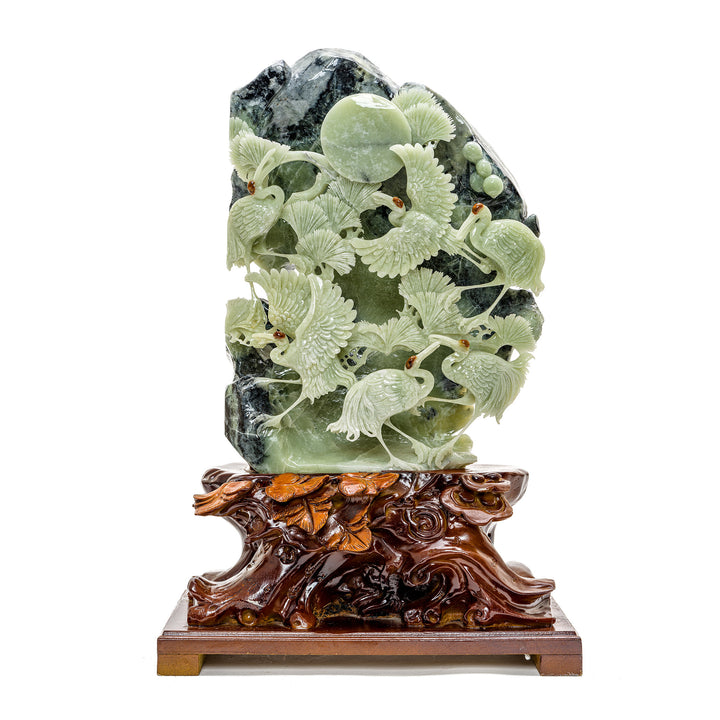 Elegant hand-carved agate crane sculpture on wooden base.
