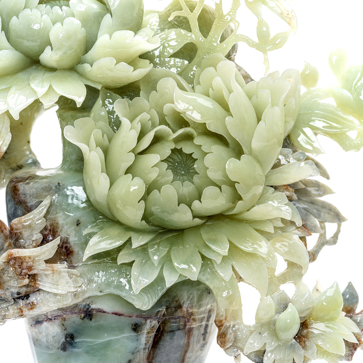 Traditional peony basket art piece with bird motifs in stone.