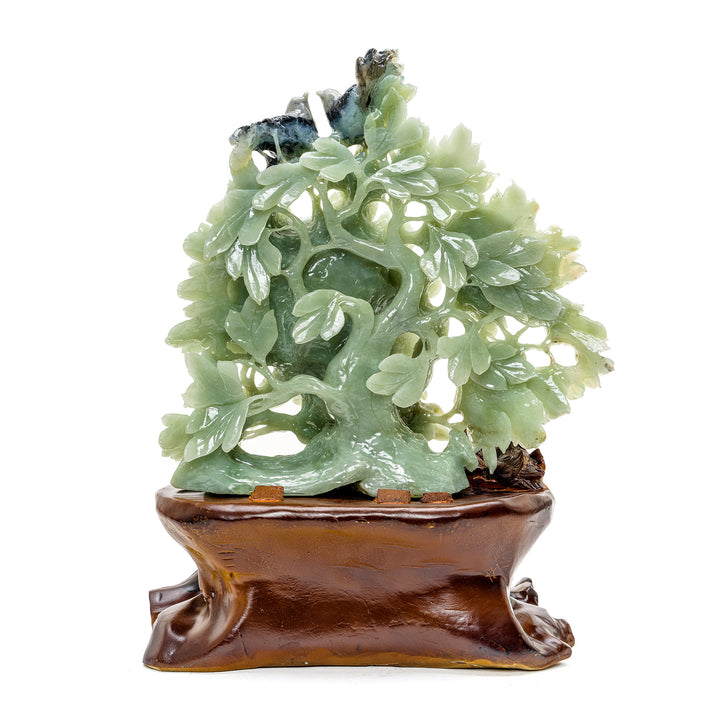 Traditional jade peony carving with perched birds