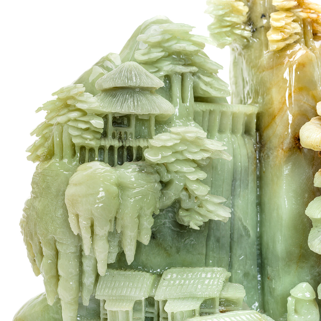 Detailed agate village scene against a mountainside backdrop