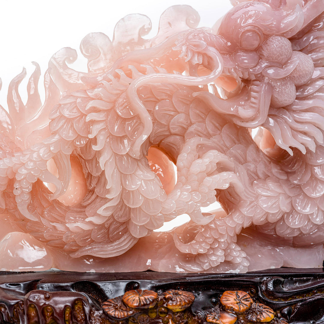 Carved dragon of rose quartz, bringing love and power to decor.