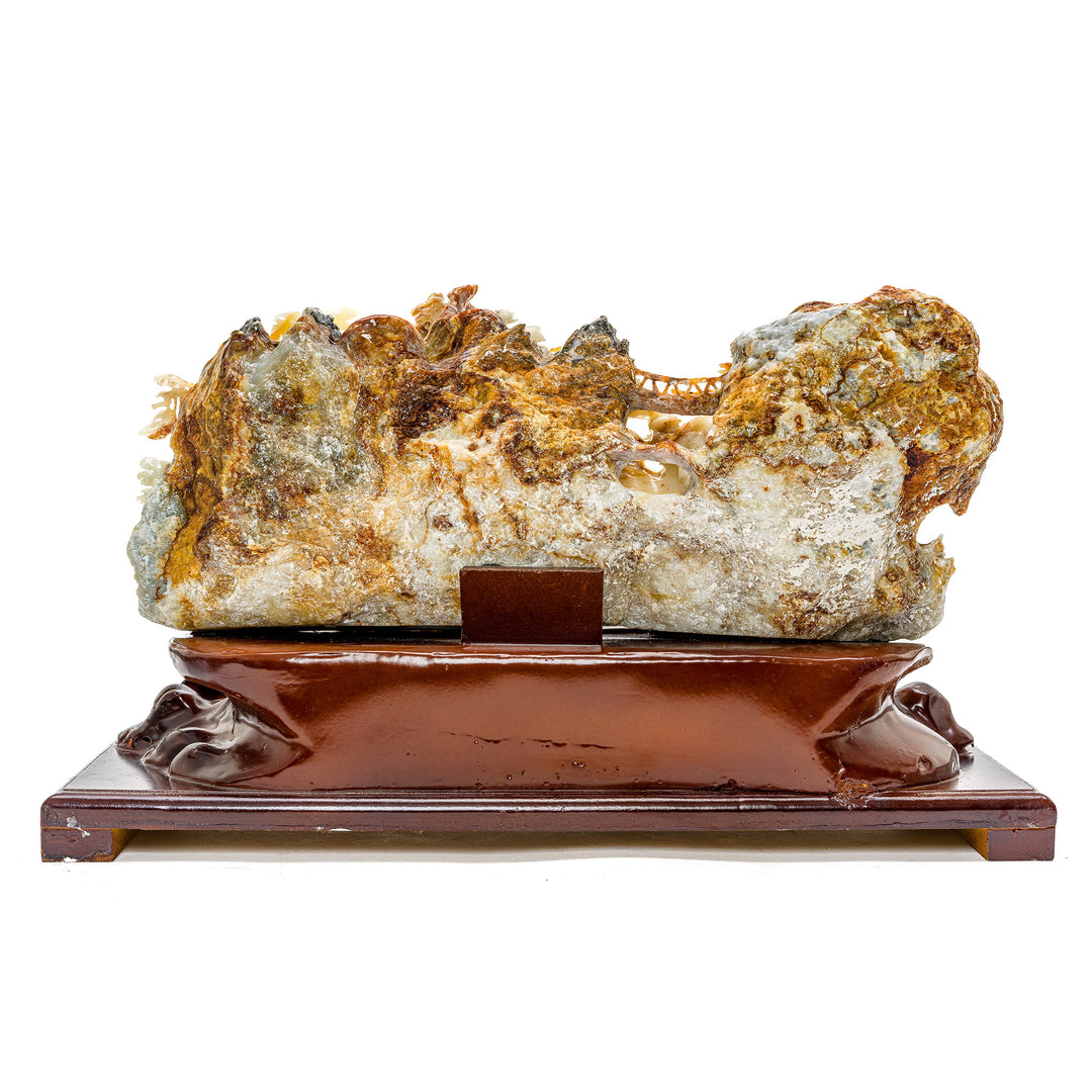 Handcrafted agate mountainside with village and trees