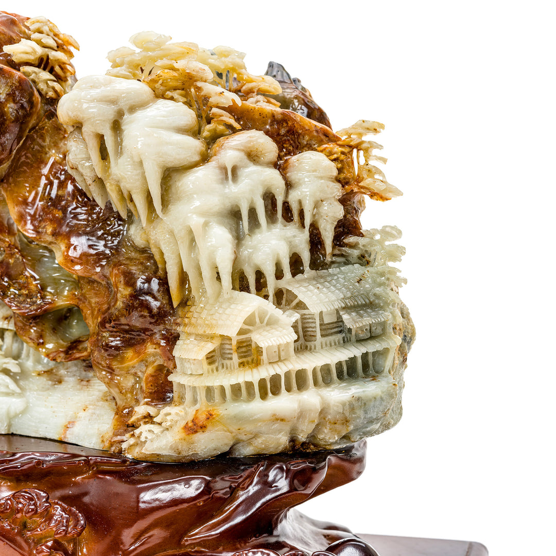 Miniature agate village scene amid natural stone trees