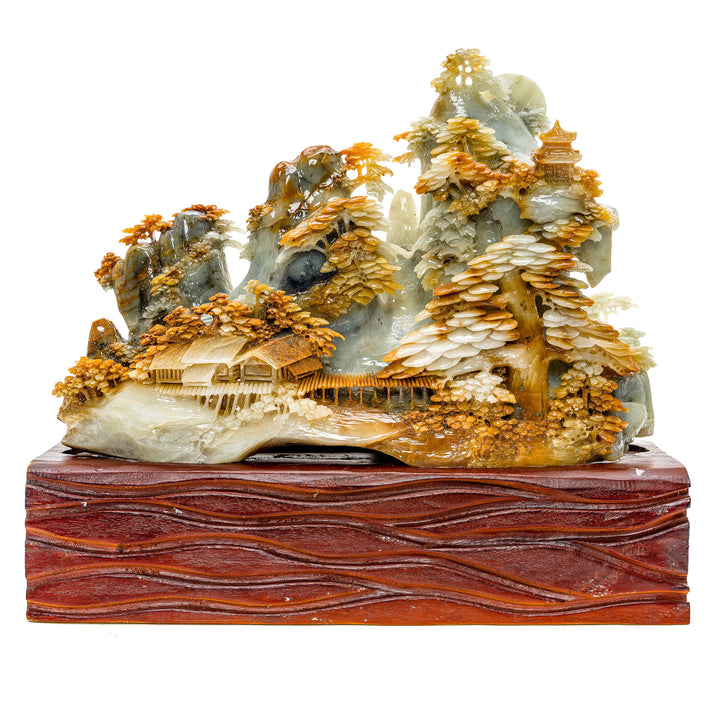 Hand-carved agate village with pagodas and pine trees