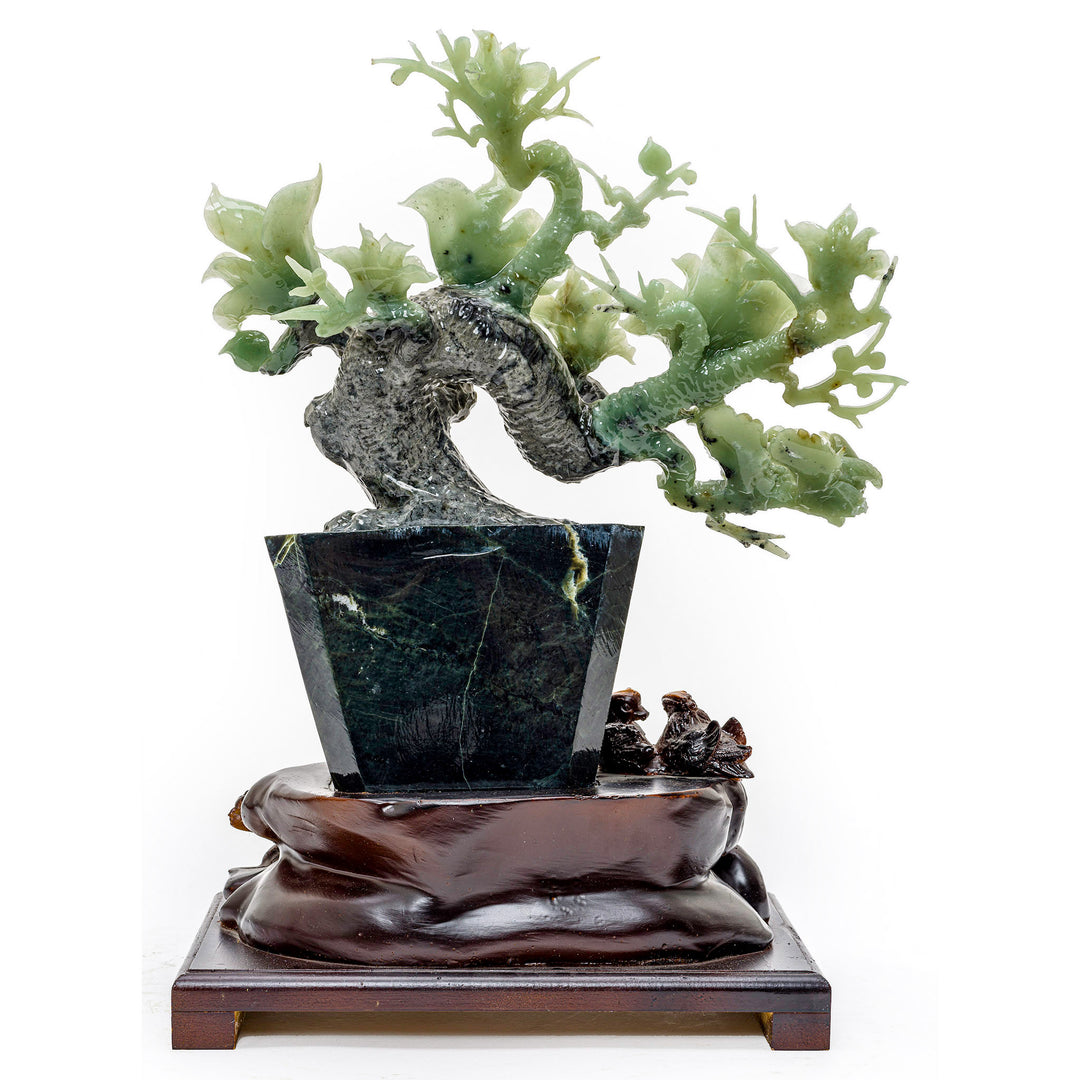 Artistic sculpture of irises in agate, presented in an elegant vase form.