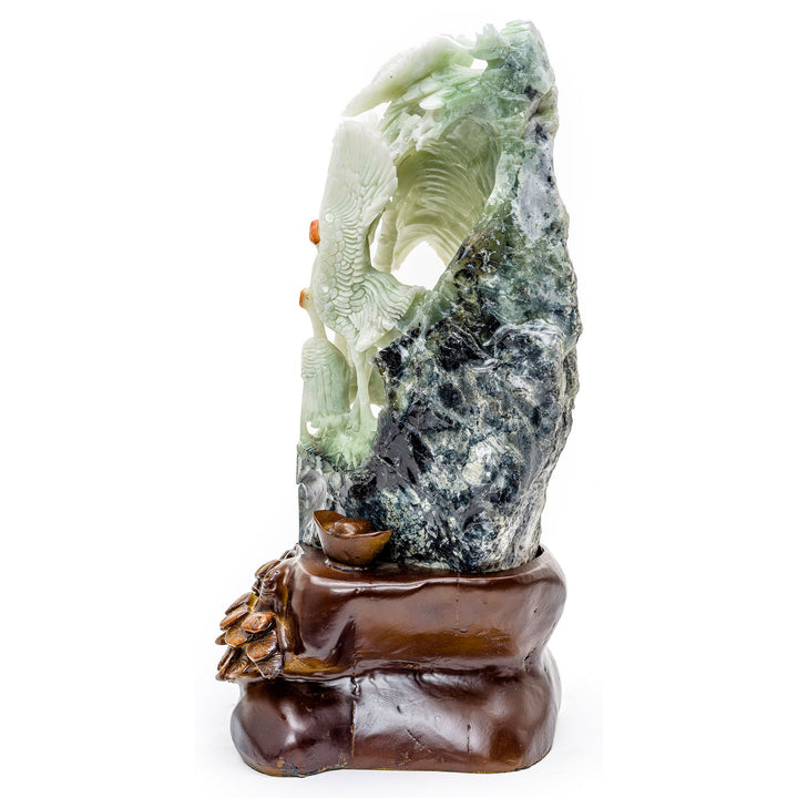 Agate carving of cranes on a hill, symbolizing happiness and youth.