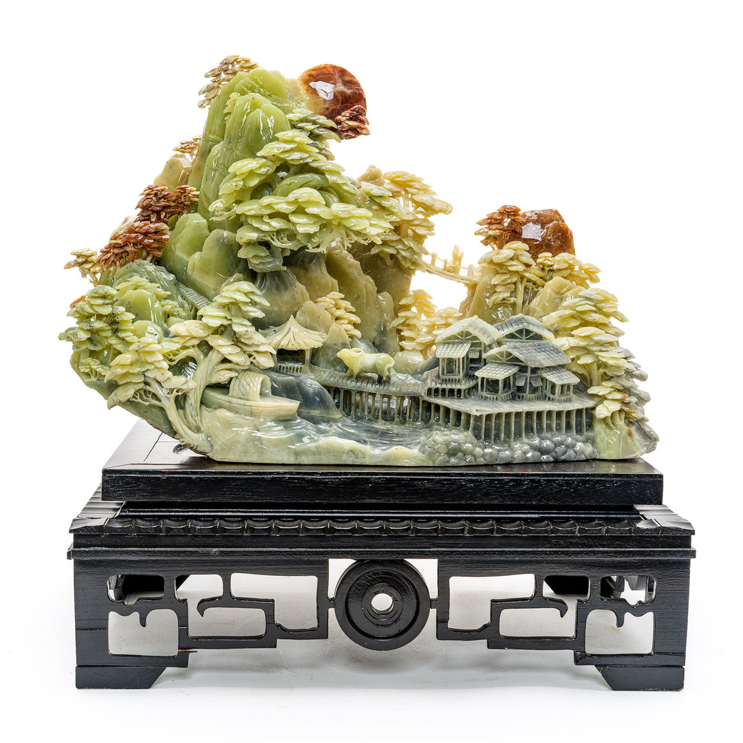 Artisan-carved agate sculpture of mountainside village