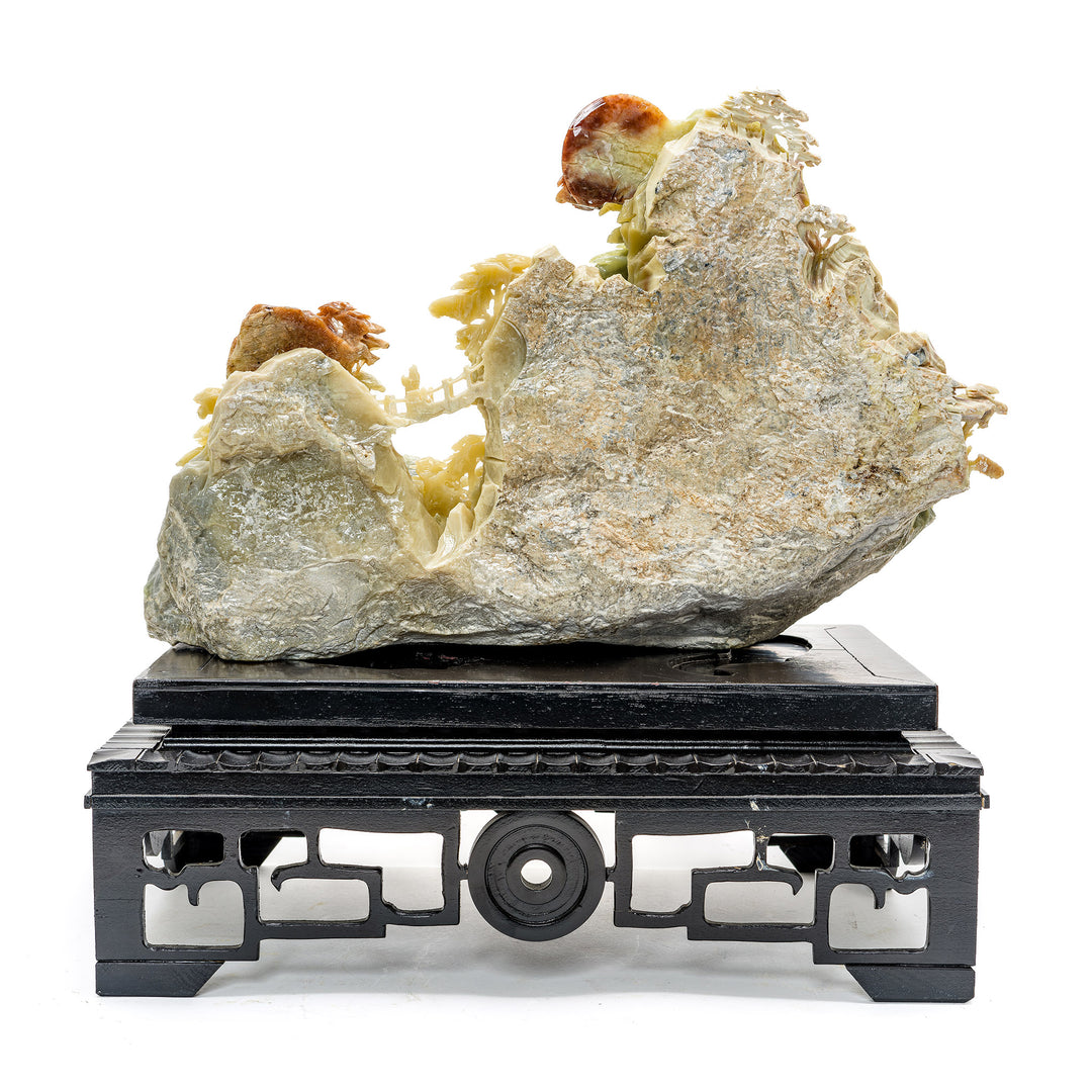 Handcrafted agate stone village against a mountainscape