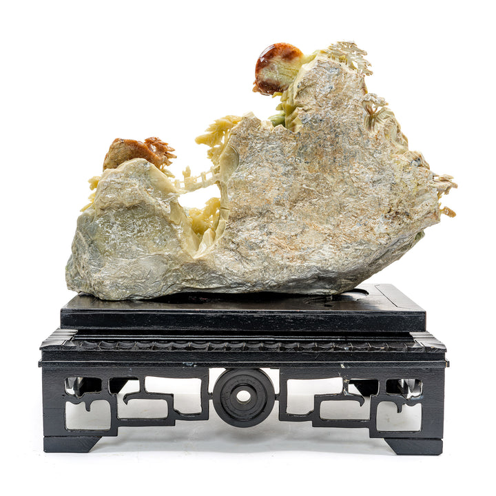 Handcrafted agate stone village against a mountainscape