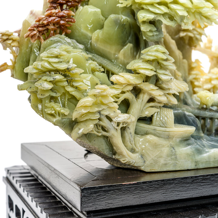 Collectible agate sculpture of a village and mountain terrain