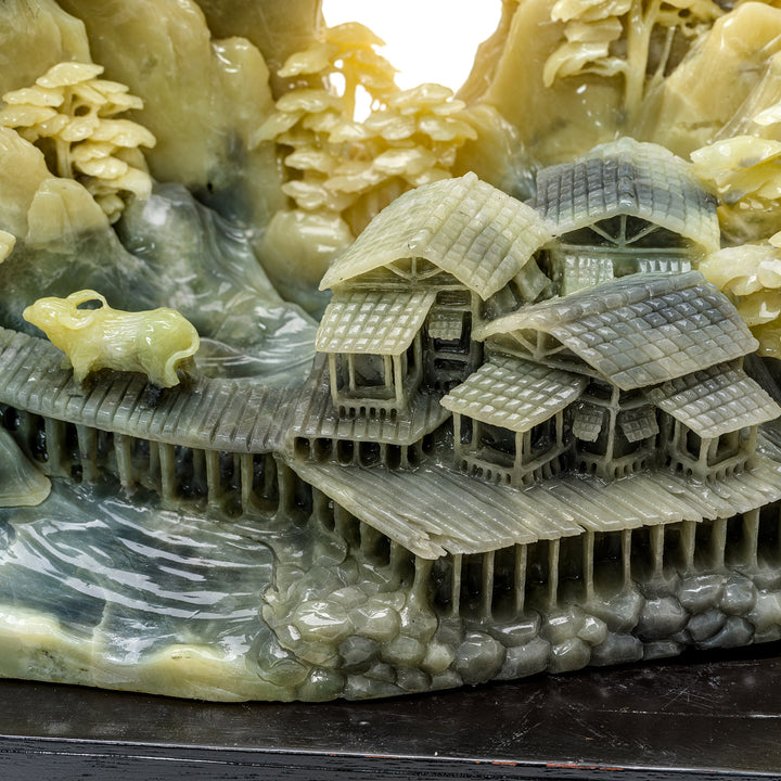 Artisan village scene carved into natural agate stone