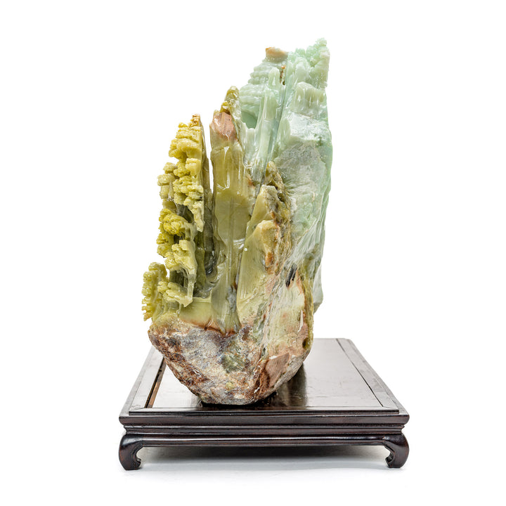 Agate sculpture of Kwan Yin overlooking a carved village