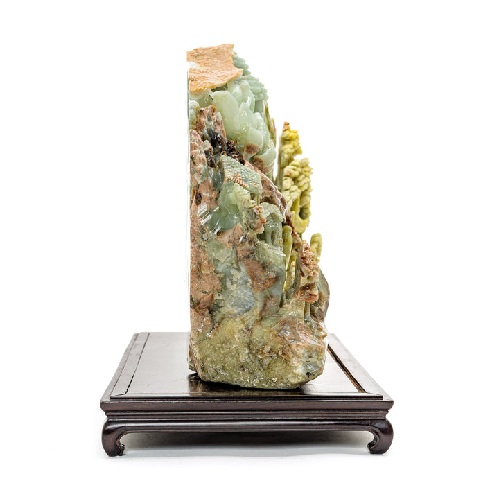 Handcrafted agate carving of Kwan Yin and village