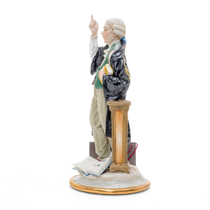 Italian crafted porcelain lawyer with law books.