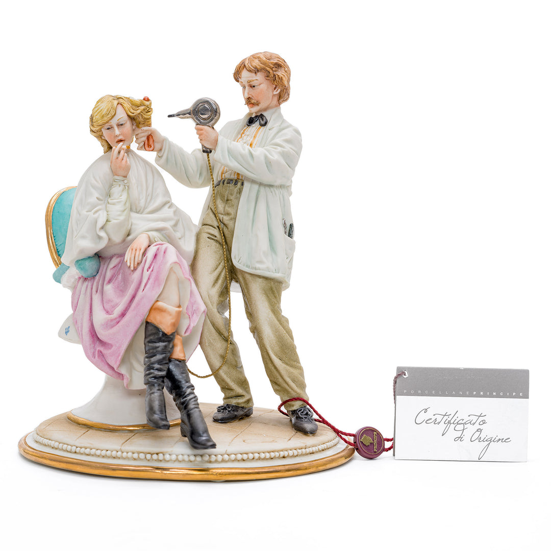 Capodimonte porcelain of a male hairdresser styling hair.