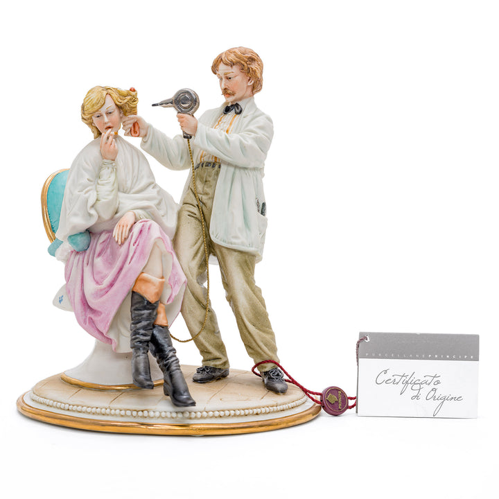 Capodimonte porcelain of a male hairdresser styling hair.