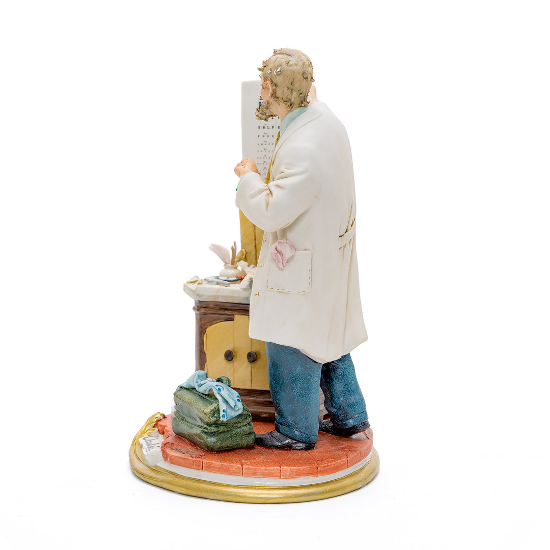 Italian crafted oculist with eye chart porcelain figurine.