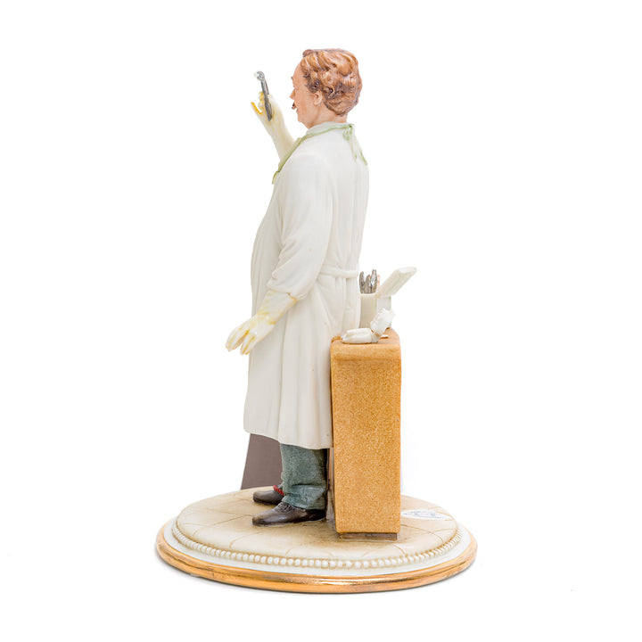 Intricately crafted dentist porcelain sculpture by Capodimonte.