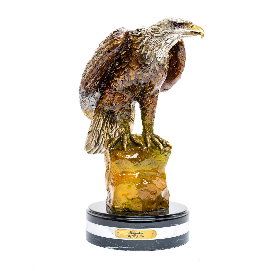 Bronze eagle perched on rock sculpture