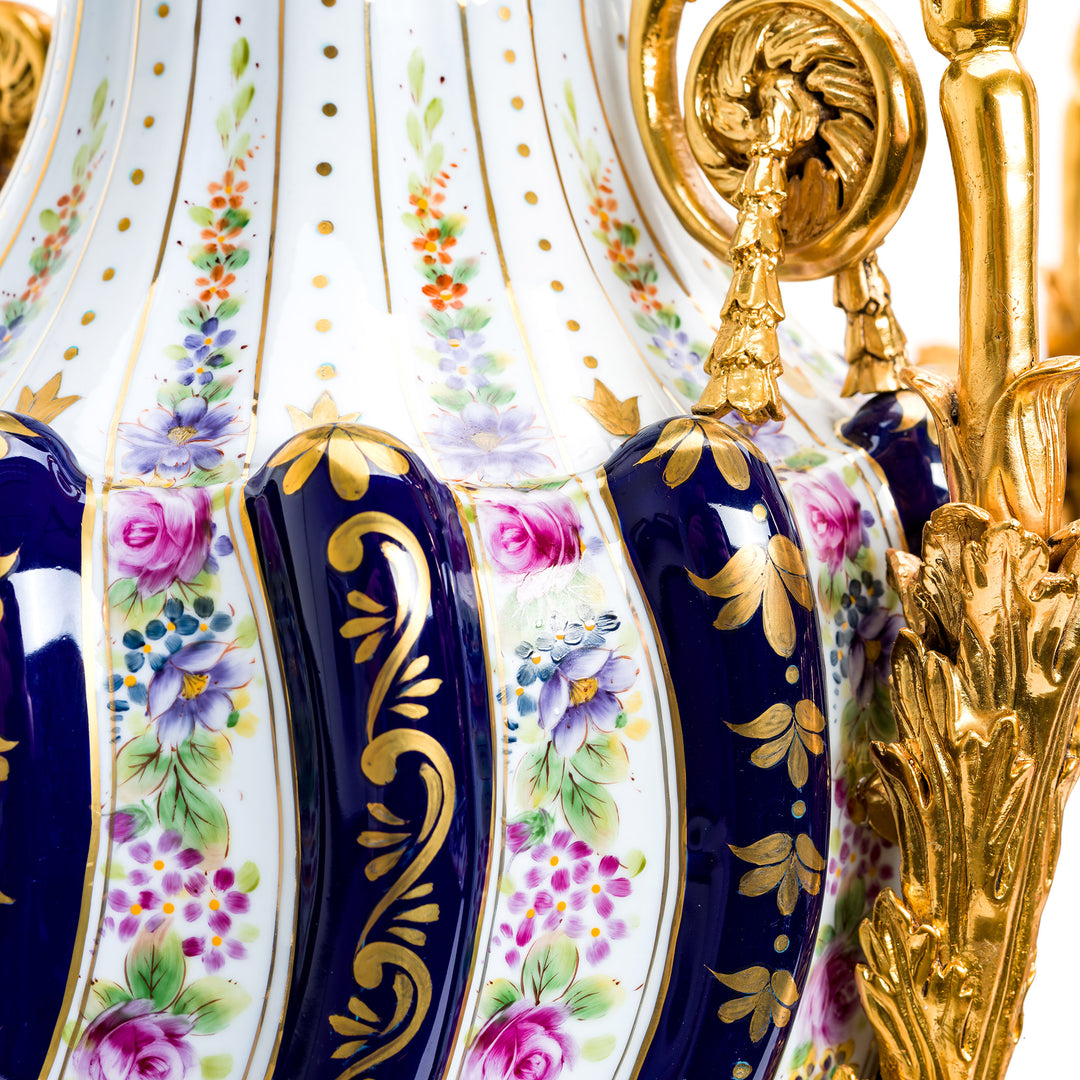 Elegant porcelain vases with floral design and gold handles
