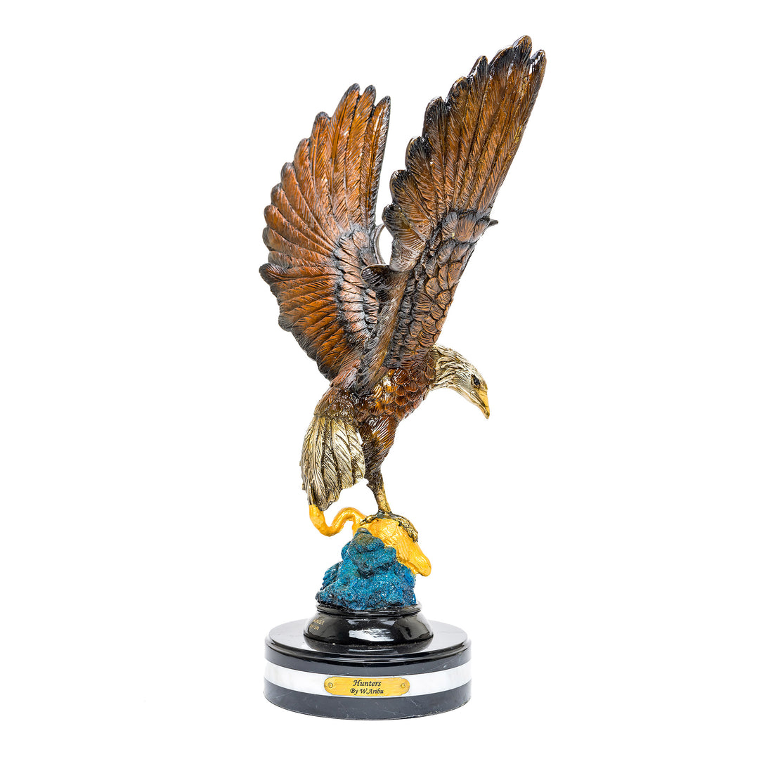Bronze eagle hunting crane sculpture on marble base.