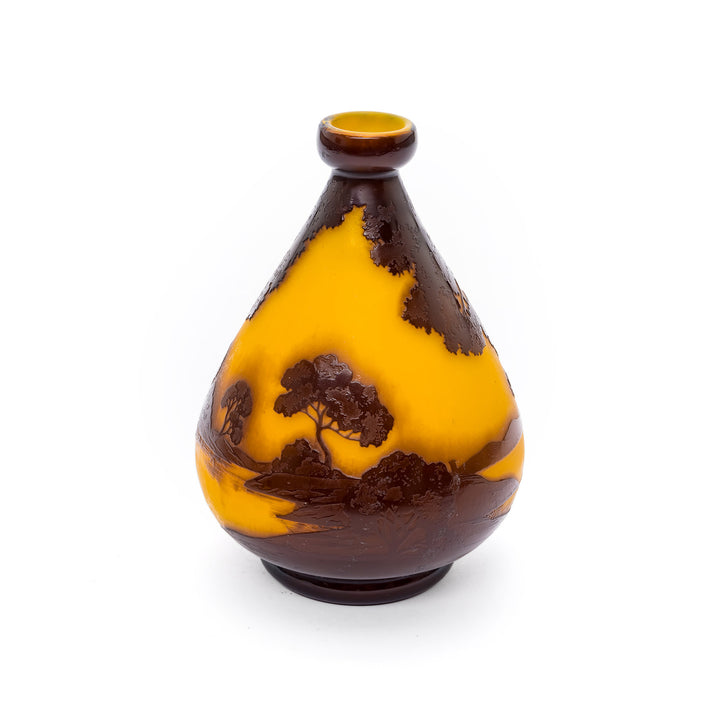 Internally decorated glass vase with trees and hills