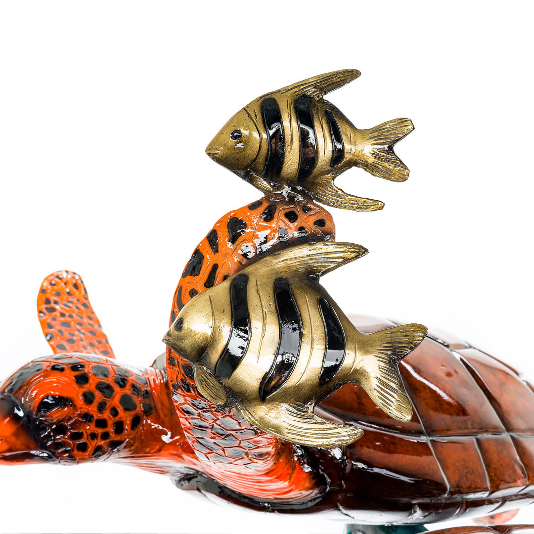 Vivid orange bronze sea turtle statue