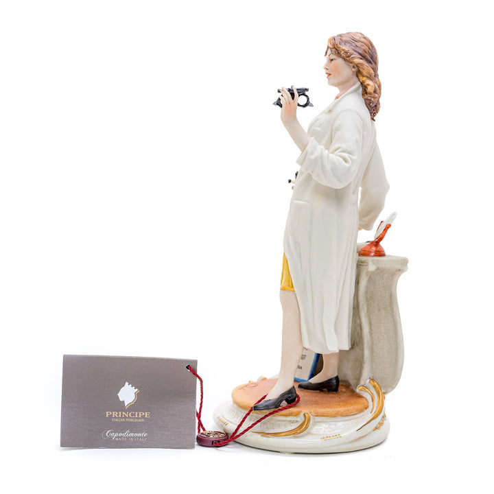 Italian crafted female oculist with medical instruments porcelain figurine.