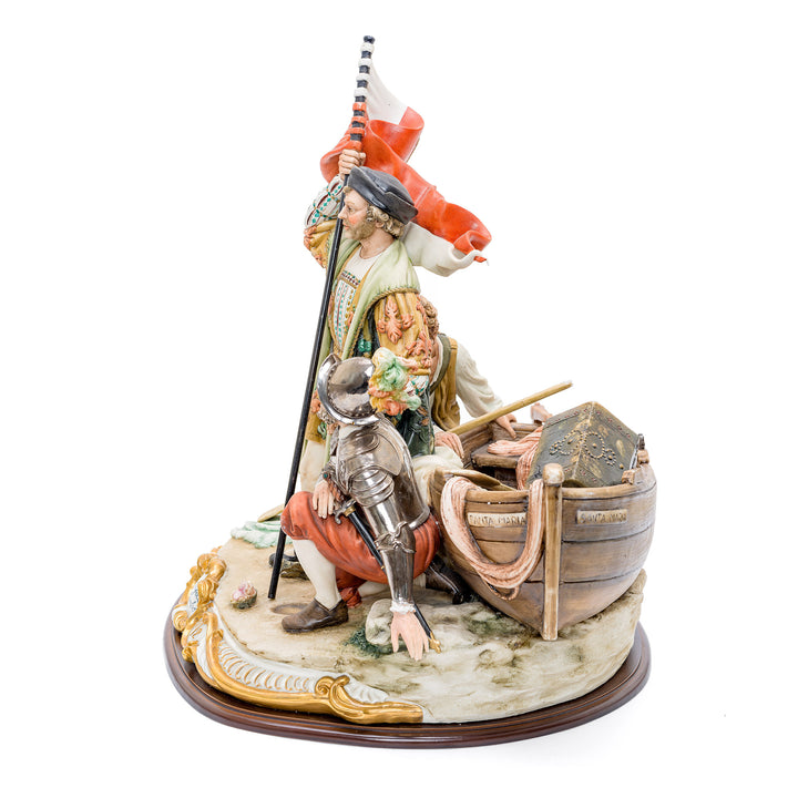 Artistic Capodimonte figurine of Cristoforo Colombo with flag and ship.